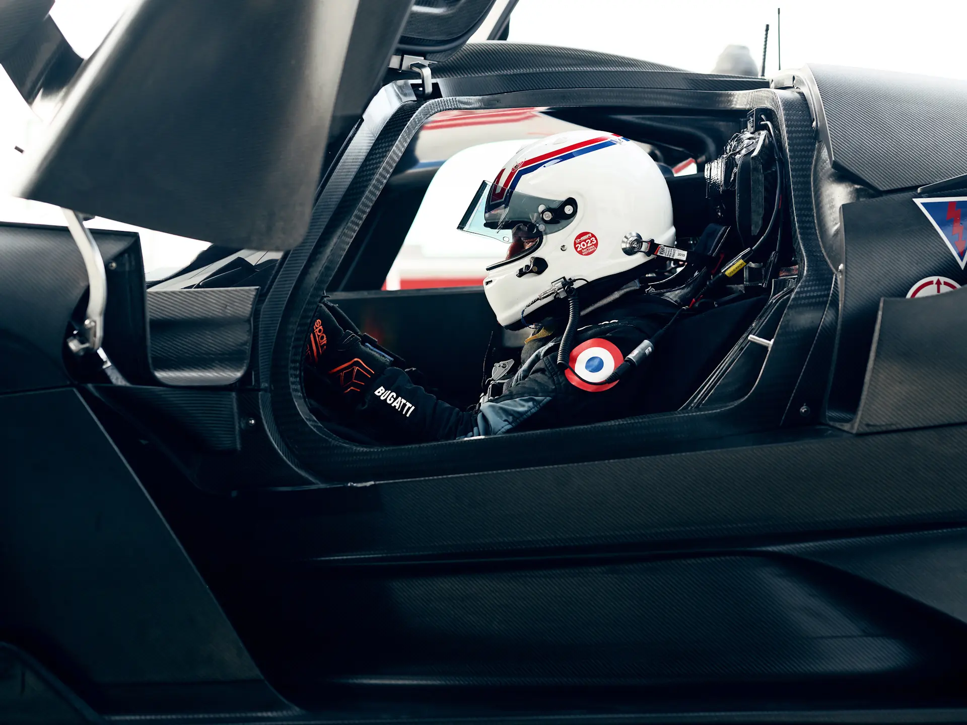 A test driver prepares himself to take to bolide out on track