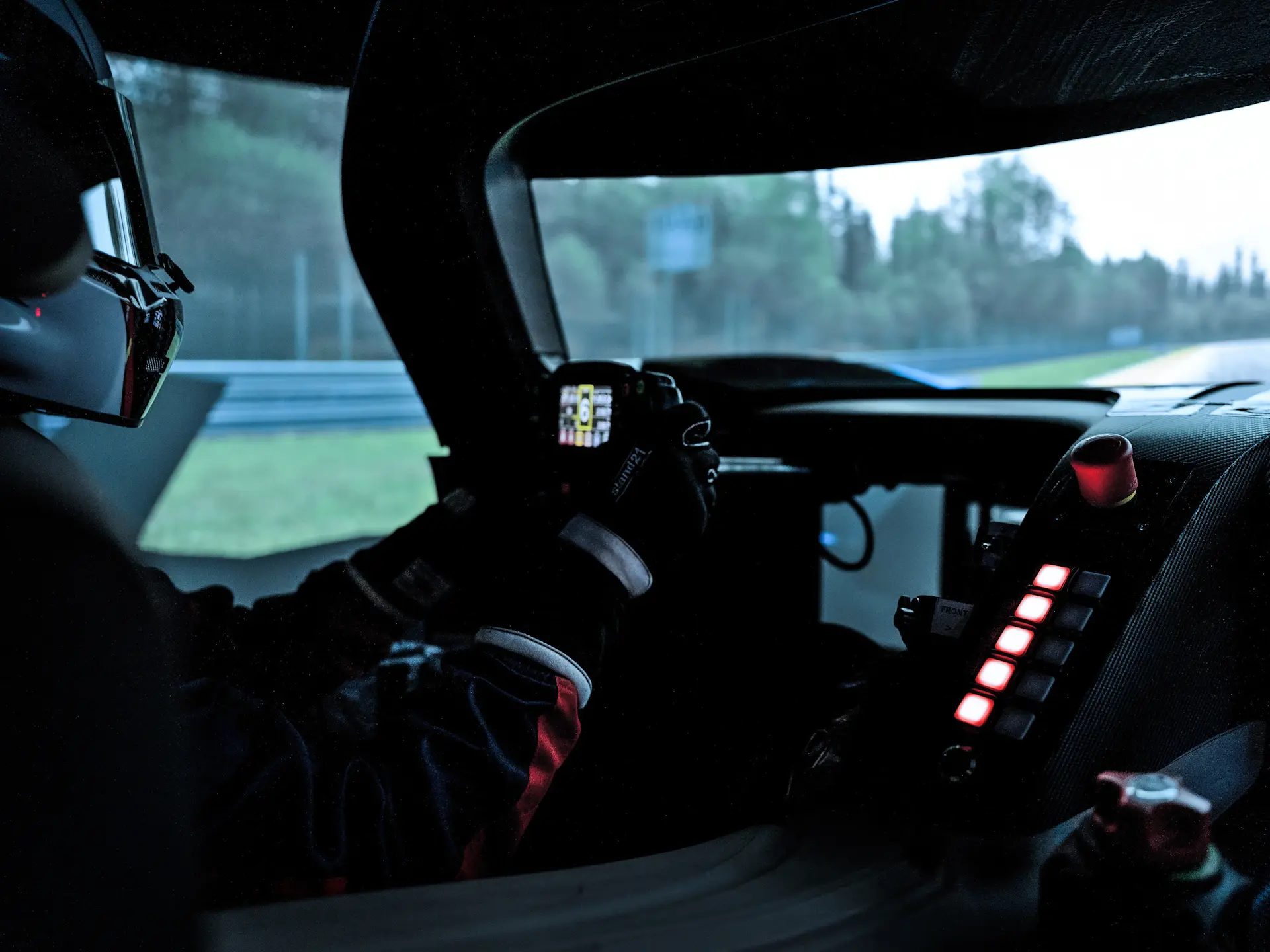 In-cockpit view of a Bolide being driven on track