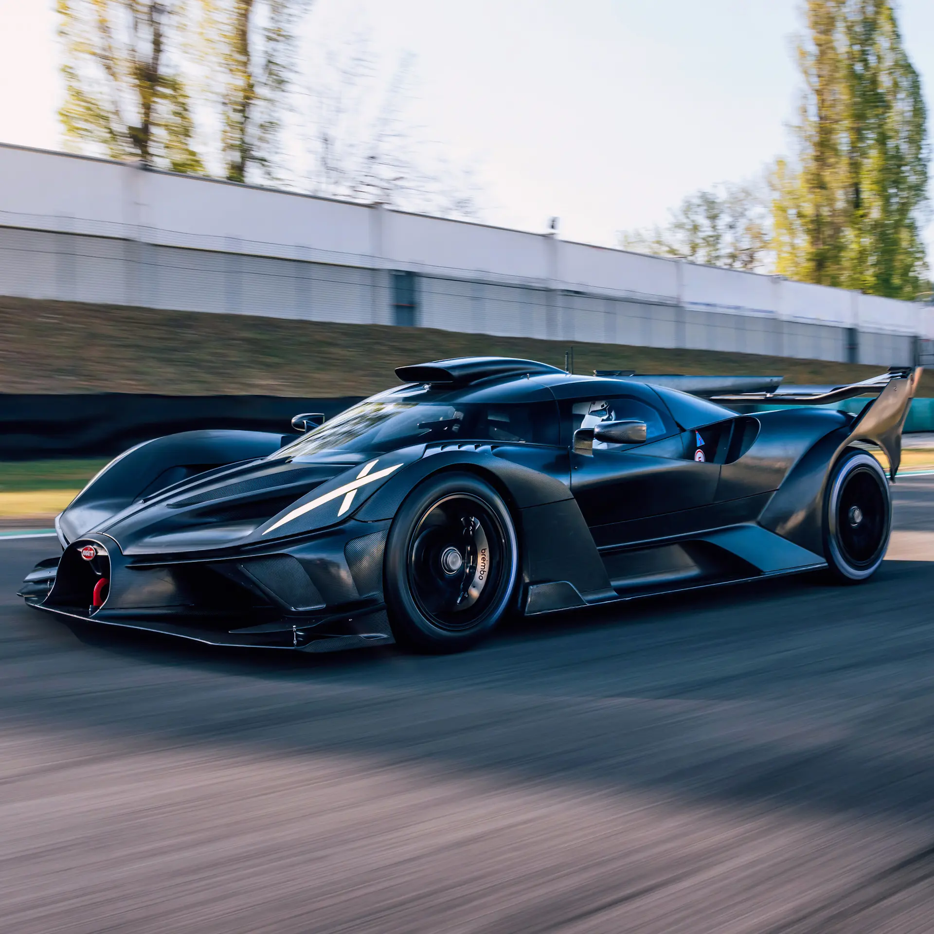 Bugatti's track-only hyper car - Bolide, glides on a dry track on a sunny day