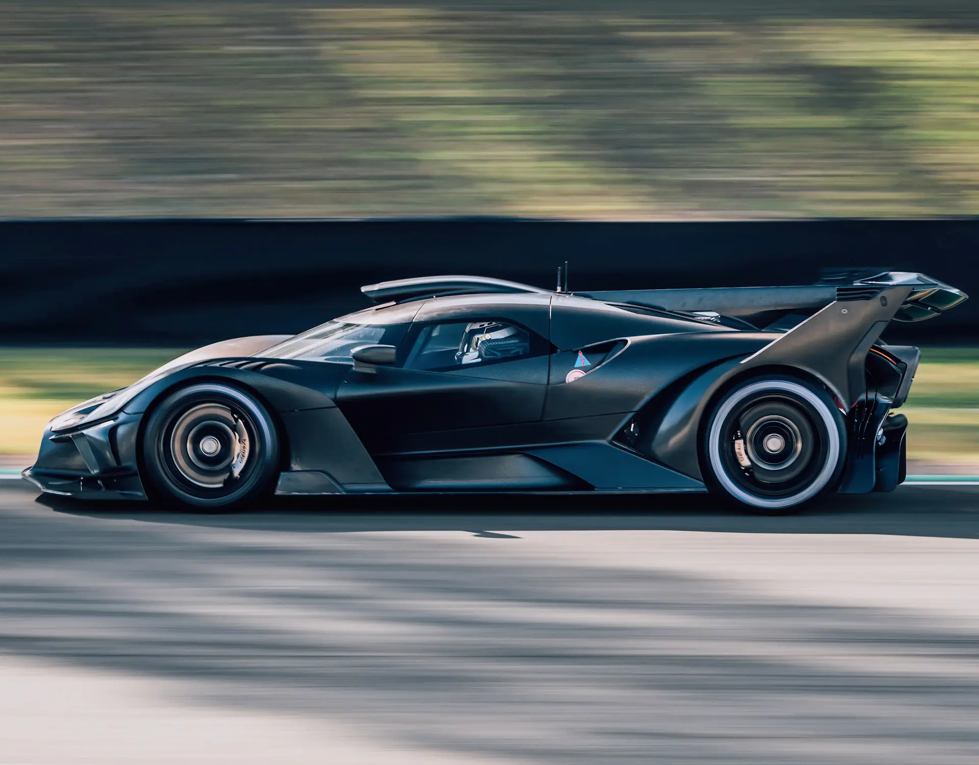 Clean side shot of the Bolide speeding on track